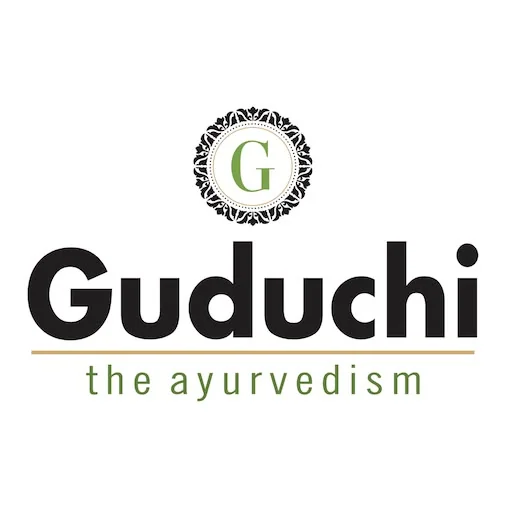 Guduchi The Ayurvedism logo with an ornate medallion monogram