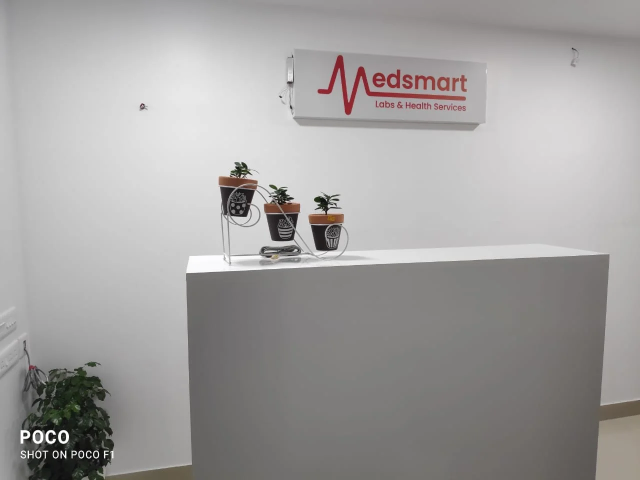 Reception desk and branded signage inside Medsmart Labs
