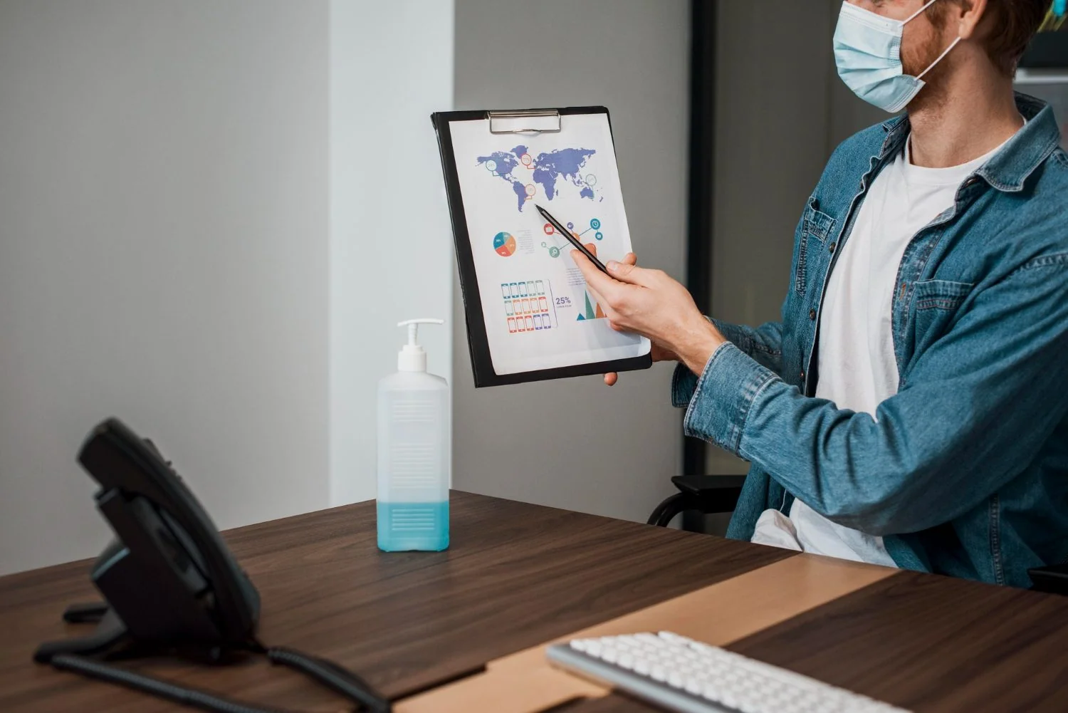 Healthcare professional presenting India market data on a clipboard